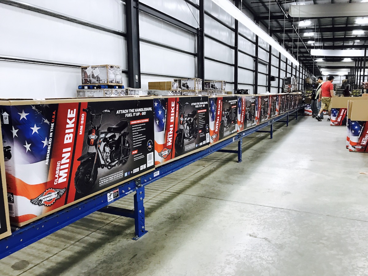 Monster Moto Product Boxes on Assembly Line Photo